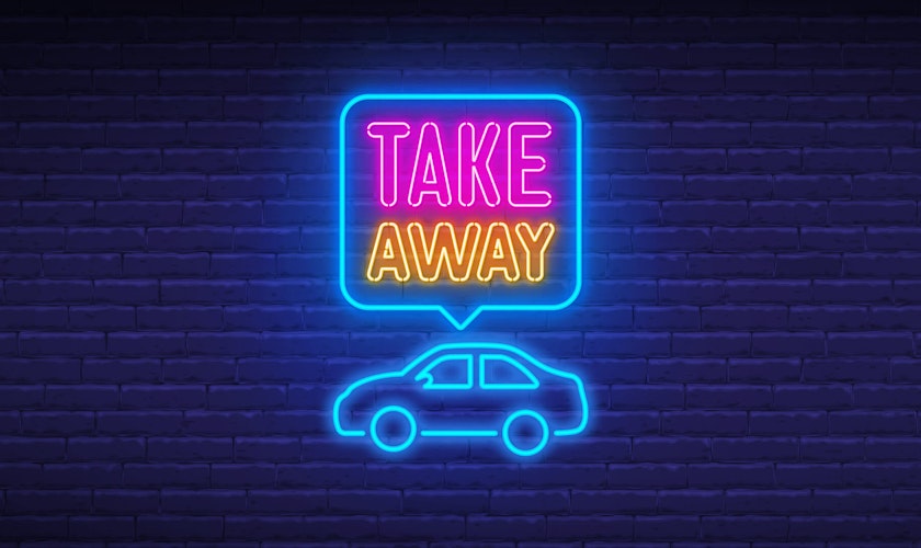 "Take away" Schriftzug mit Auto auf dunklem Hintetgrund